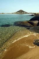 The blue serene beaches of Naxos island in the Greek Cyclades island chain.